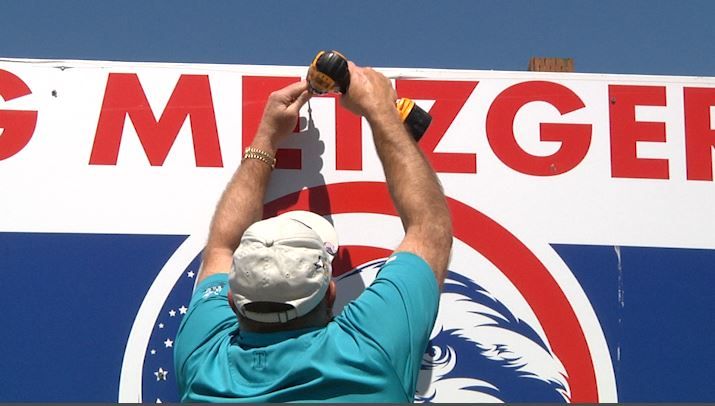 Greg Metzger takes down one of his campaign signs in Bozeman after winning the Clerk and Recorder's nomination by 6 votes.